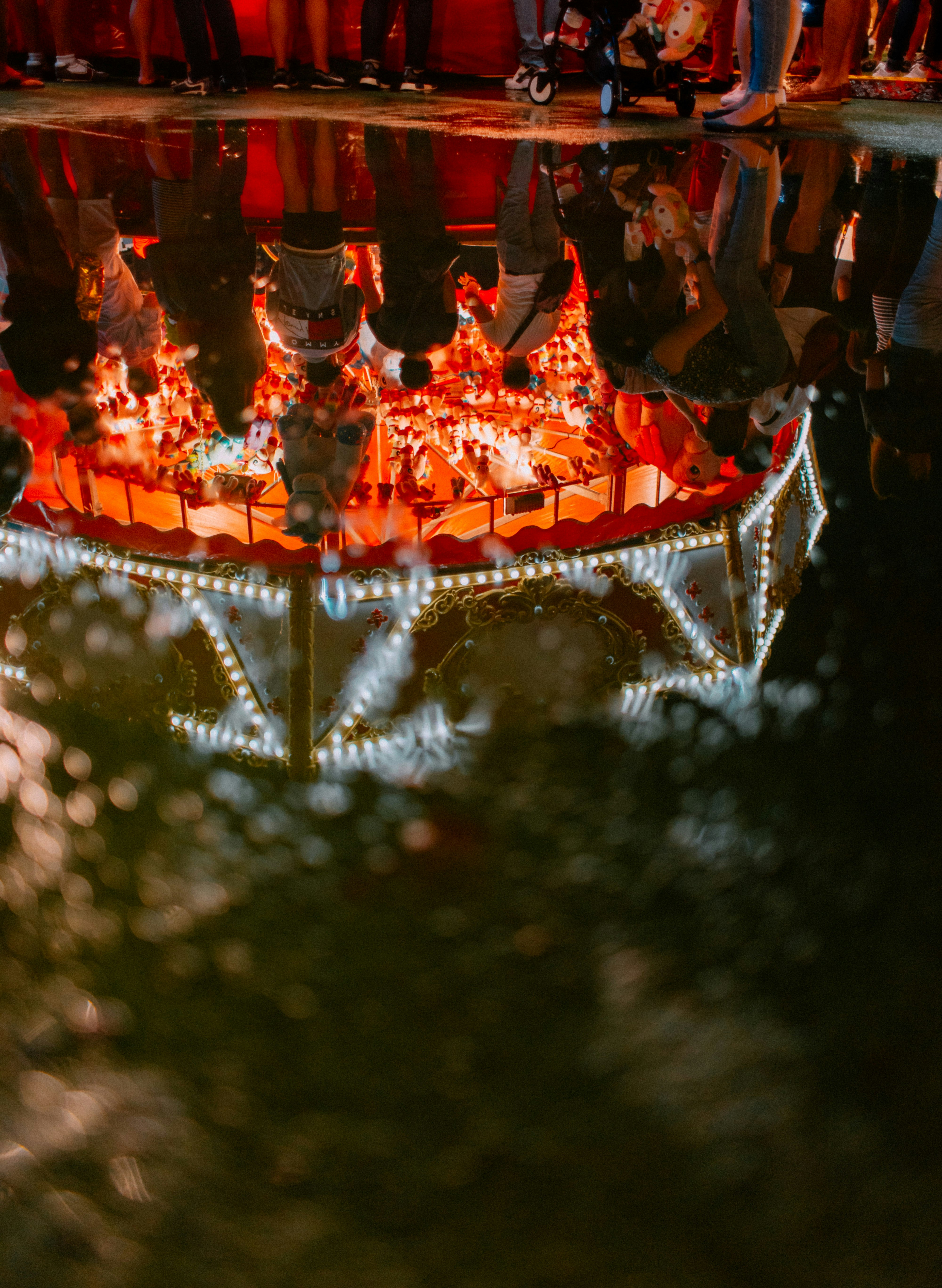 people inside carnival during nighttime